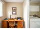 Office space adjacent to the laundry room, complete with desk and office equipment at 143 Asbury Dr # 86A, Anderson, IN 46013