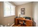 Cozy home office with natural light, desk, chair, and printer at 143 Asbury Dr # 86A, Anderson, IN 46013