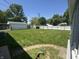 Large backyard with a lush lawn, perfect for outdoor activities at 144 Bel Aire Dr, Whiteland, IN 46184
