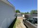 Gravel driveway leading to a detached garage, offering ample parking space at 144 Bel Aire Dr, Whiteland, IN 46184