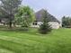 Large, well-maintained backyard with mature trees offering plenty of shade and privacy at 1604 Stonewall Dr, Greenfield, IN 46140
