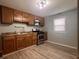 Kitchen featuring stainless steel appliances, wood cabinetry, and modern countertops at 1605 S Whittier Pl, Indianapolis, IN 46203