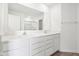 Modern bathroom featuring a double sink vanity with white cabinets, quartz countertop and large mirror at 1614 N Clearwater Dr, Greenfield, IN 46140
