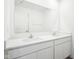 Bathroom featuring dual sinks, quartz countertop, and large mirror at 1614 N Clearwater Dr, Greenfield, IN 46140
