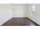 Bright bedroom featuring light hardwood flooring and a large window at 1614 N Clearwater Dr, Greenfield, IN 46140