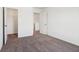 Bedroom with neutral carpeting and open doorway entrance with coat closet at 1614 N Clearwater Dr, Greenfield, IN 46140