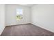 Light and airy bedroom with a window view and plush neutral carpet at 1614 N Clearwater Dr, Greenfield, IN 46140