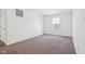 Bedroom with neutral carpet, white walls, and double-hung window views at 1614 N Clearwater Dr, Greenfield, IN 46140