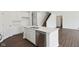 Spacious kitchen island with stainless steel dishwasher, double sink, and quartz countertops at 1614 N Clearwater Dr, Greenfield, IN 46140