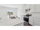 Bright kitchen island with stainless steel stove and backyard views at 1614 N Clearwater Dr, Greenfield, IN 46140