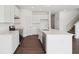 Bright kitchen features white cabinets, stainless steel appliances, and a large island with seating at 1614 N Clearwater Dr, Greenfield, IN 46140