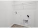 Bright laundry room with essential hookups and modern fixtures at 1614 N Clearwater Dr, Greenfield, IN 46140