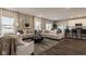 Open-concept living room with hardwood floors, ample natural light, and stylish furniture at 1614 N Clearwater Dr, Greenfield, IN 46140