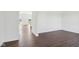 Open-concept living room with dark hardwood flooring and ample natural light at 1614 N Clearwater Dr, Greenfield, IN 46140