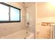 Bright bathroom featuring a marble-tiled shower, toilet, and vanity at 1709 E Loretta Dr, Indianapolis, IN 46227