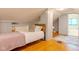 Charming bedroom featuring a sleeping area, desk space, and open shower at 1709 E Loretta Dr, Indianapolis, IN 46227