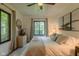 Bright bedroom featuring a ceiling fan, neutral color scheme, and large windows at 1709 E Loretta Dr, Indianapolis, IN 46227