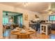 Bright, combined kitchen and dining area featuring modern decor, table seating, and hardwood floors at 1709 E Loretta Dr, Indianapolis, IN 46227