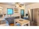 Well-lit kitchen with stainless steel appliances, white cabinets and countertops, and shiplap accent walls at 1709 E Loretta Dr, Indianapolis, IN 46227