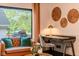 Comfortable living room seating area with desk, stylish decor, and natural light from backyard window at 1709 E Loretta Dr, Indianapolis, IN 46227