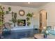Cozy living room boasts fireplace, arched doorway, stylish furnishings, and decorative shelving with greenery at 1709 E Loretta Dr, Indianapolis, IN 46227