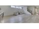 Spacious basement with light wood floors, plenty of natural light and cozy sitting area with armchairs at 17346 Newton Main St, Westfield, IN 46074
