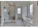 Bathroom featuring a glass enclosed shower and a freestanding soaking tub at 17346 Newton Main St, Westfield, IN 46074