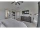 Primary bedroom featuring neutral walls, a ceiling fan, ensuite bathroom and lots of natural light at 17346 Newton Main St, Westfield, IN 46074