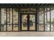 Elegant entrance to a community center with glass doors and stone accents at 17346 Newton Main St, Westfield, IN 46074