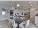 Open-concept dining room connected to a modern kitchen and cozy living space at 17346 Newton Main St, Westfield, IN 46074