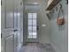 Mudroom with board and batten walls, open shelving and herringbone floors at 17346 Newton Main St, Westfield, IN 46074