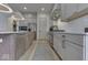 Contemporary kitchen featuring modern appliances, gray cabinetry, and an airy design at 17346 Newton Main St, Westfield, IN 46074