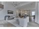 Open concept living room features a sofa, chairs, and open access to kitchen at 17346 Newton Main St, Westfield, IN 46074