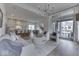Open concept living room with large sliding glass doors, chairs, and chandelier at 17346 Newton Main St, Westfield, IN 46074