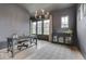 Office with modern chandelier, dark paint, large desk, and decorative rug at 17346 Newton Main St, Westfield, IN 46074