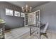Bright office space with French doors, wood floors, and gray walls, illuminated by a stylish chandelier at 17346 Newton Main St, Westfield, IN 46074