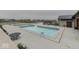 Community pool area featuring multiple pools, lounge chairs, and adjacent recreation building at 17346 Newton Main St, Westfield, IN 46074