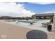 A lovely community pool area featuring multiple pools, lounge chairs, and adjacent recreation building at 17346 Newton Main St, Westfield, IN 46074