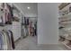 Spacious walk-in closet with custom shelving, drawers, and ample storage for clothes and accessories at 17346 Newton Main St, Westfield, IN 46074