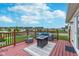 Cozy back deck with comfortable outdoor seating and neighborhood view on a sunny day at 17949 Scout Ln, Westfield, IN 46074