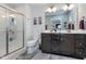 Bathroom with a double sink vanity, glass shower, and modern fixtures at 17949 Scout Ln, Westfield, IN 46074