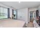 Bright bedroom with large windows, neutral carpet, and a double door closet at 17949 Scout Ln, Westfield, IN 46074