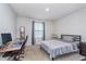 Simple bedroom with neutral carpet, a window with blinds and a desk for studying at 17949 Scout Ln, Westfield, IN 46074