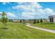 Scenic community view of the walking path, pond, and well-maintained lawns on a bright day at 17949 Scout Ln, Westfield, IN 46074