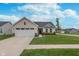 Charming one-story home featuring a pristine lawn, well-manicured landscaping, and a two-car garage at 17949 Scout Ln, Westfield, IN 46074