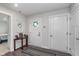 Bright foyer with a decorative table, mirror, and a view into other rooms of the home at 17949 Scout Ln, Westfield, IN 46074