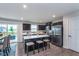 Well-equipped kitchen features modern appliances, a center island with seating, and access to outdoor patio at 17949 Scout Ln, Westfield, IN 46074