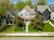 Stunning aerial view of a charming two-story home with mature trees and well-manicured landscaping at 2016 Central Ave, Indianapolis, IN 46202