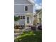 Charming backyard patio with comfortable seating, a grill, and beautiful landscaping, ideal for relaxation at 2016 Central Ave, Indianapolis, IN 46202