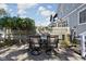 Spacious backyard patio with an outdoor dining area surrounded by a well-maintained wooden fence at 2016 Central Ave, Indianapolis, IN 46202